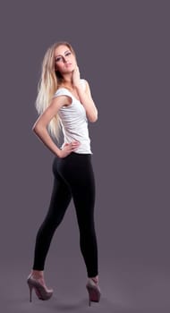 Young girl with blond hair in dance look at you