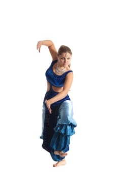 Young woman posing in arabia dance - traditional blue costume