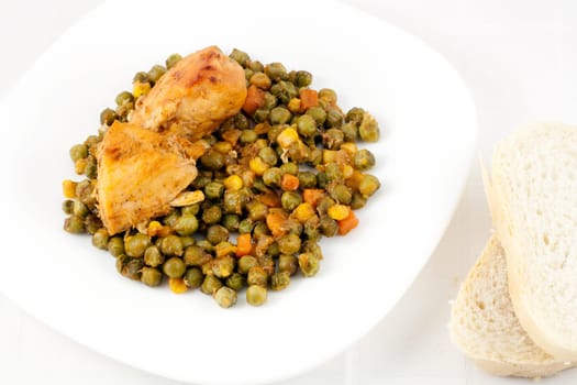 Baked chicken meat with green peas, carrots, corns and two slices of bread