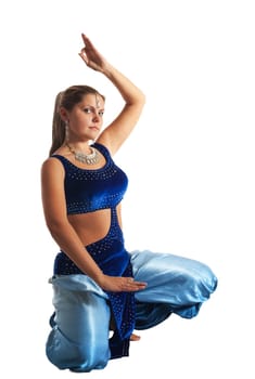 Young woman posing in arabia dance - traditional blue costume