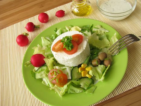 Fresh goat cheese on salad