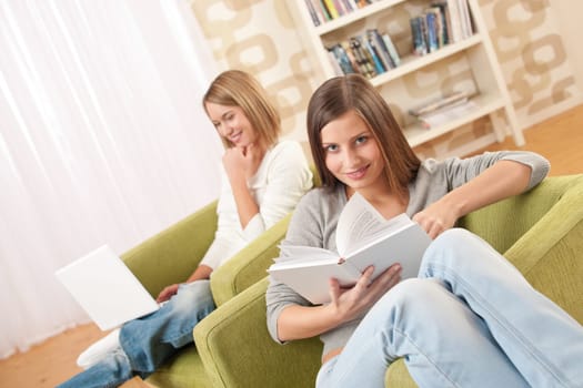 Students - Two female teenager studying in modern living room