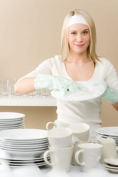 Modern kitchen - happy woman washing dishes, housework