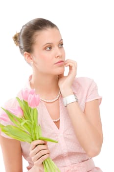 Fashion - young romantic woman in designer clothes with spring tulips