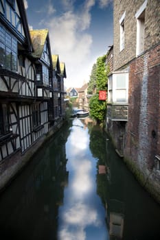 Historical houses in England, reflection of sky in water