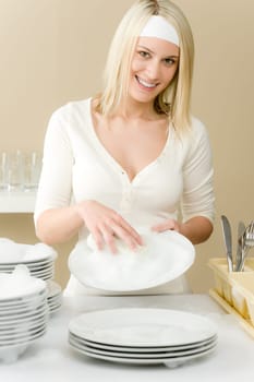 Modern kitchen - happy woman washing dishes, housework