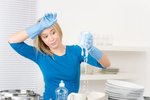 Modern kitchen - frustrated woman washing dishes, housework