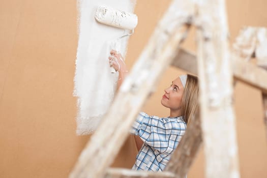 Home improvement: Woman painting wall