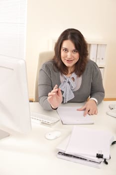 Young business woman working at modern office with computer