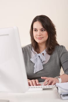 Young business woman working at modern office with computer