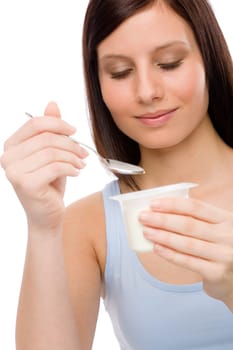 Healthy lifestyle - portrait of young woman eat yogurt