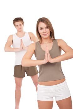 Fitness - Young healthy couple in yoga position on white background