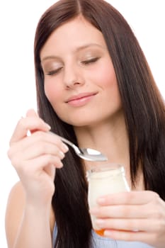 Healthy lifestyle - portrait of young woman eat yogurt