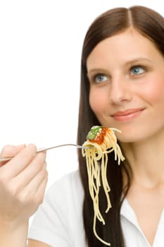 Italian food - portrait of healthy woman eat spaghetti with sauce