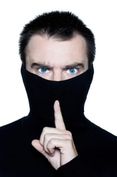 caucasian man portrait behind his turtle polo neck gesturing silence portrait on studio isolated white background