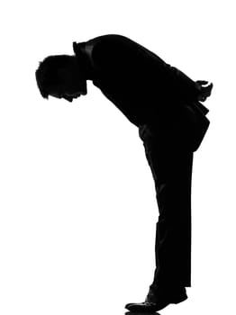 silhouette caucasian business man   man  tip toe looking down expressing behavior full length on studio isolated white background