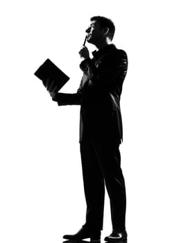 silhouette caucasian business man with note pad thinking expressing behavior full length on studio isolated white background
