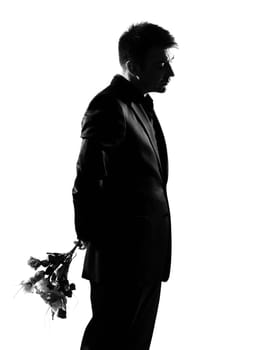 silhouette caucasian business man offering flowers expressing behavior full length on studio isolated white background