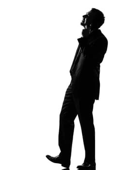 silhouette caucasian business man on the phone expressing behavior full length on studio isolated white background
