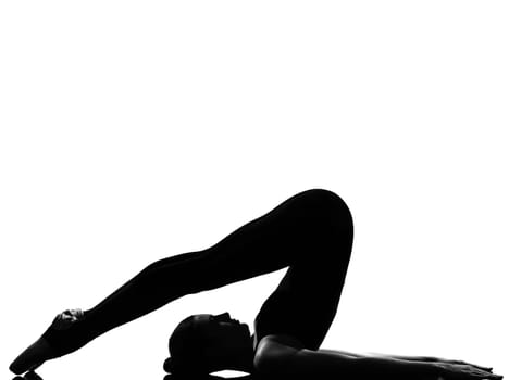 beautiful caucasian tall woman ballet dancer halasana Shoulder Stand yoga pose full length on studio isolated white background
