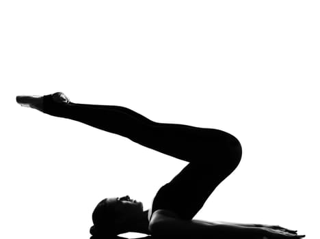 beautiful caucasian tall woman ballet dancer halasana Shoulder Stand yoga pose full length on studio isolated white background