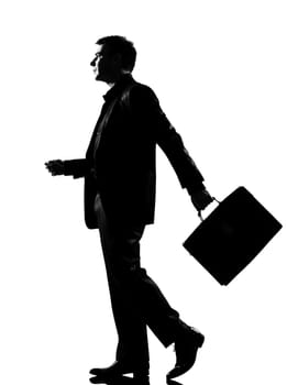 silhouette caucasian business man   walking profile with briefcase  full length on studio isolated white background