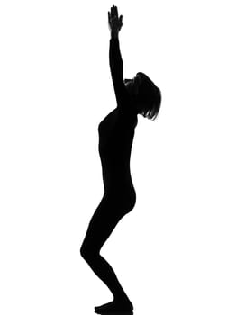 woman utkatasana chair position yoga pose posture position in silouhette on studio white background full length