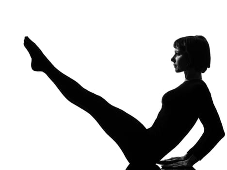 woman paripurna navasana boat pose yoga posture position in silouhette on studio white background