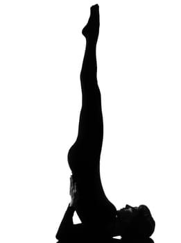 woman salamba sarvangasana Shoulder Stand yoga pose  posture position in silouhette on studio white background full length