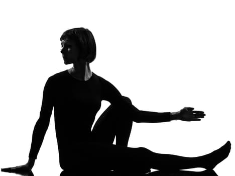 woman Marichyasana yoga sage pose posture position in silouhette on studio white background full length
