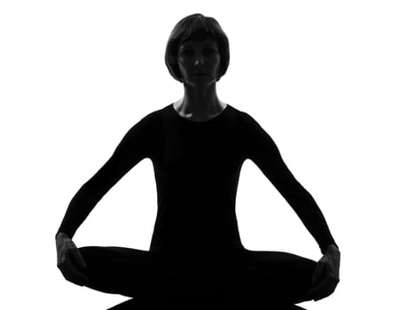woman yoga sukhasana pose posture position in silouhette on studio white background