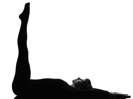 woman salamba sarvangasana Shoulder Stand yoga pose  posture position in silouhette on studio white background full length
