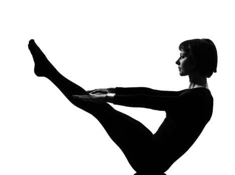 woman paripurna navasana boat pose yoga posture position in silouhette on studio white background