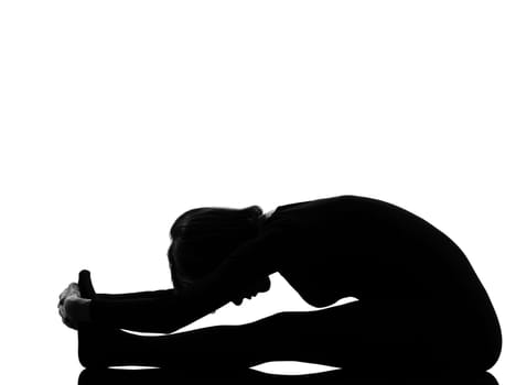 woman paschimottanasana yoga pose posture position in silouhette on studio white background full length