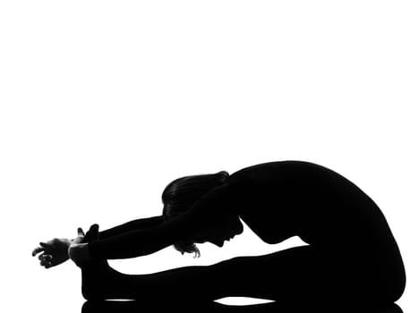 woman paschimottanasana yoga pose posture position in silouhette on studio white background full length