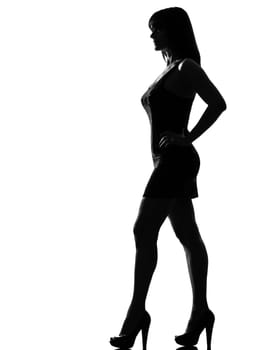 stylish silhouette caucasian beautiful woman standing profile full length on studio isolated white background