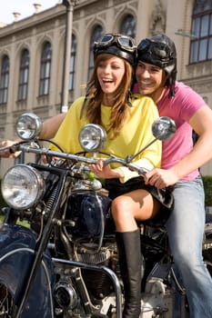 Happy couple on a motorcycle