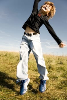 Boy jumps in the air