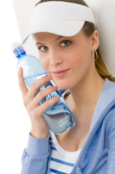 Sport - young woman in summer fitness outfit with water bottle