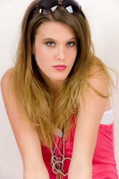 Fashion model - young trendy woman in pink, studio shoot