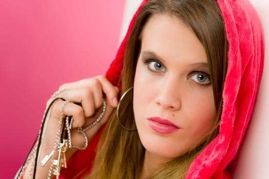 Fashion model - young trendy woman in pink, studio shoot