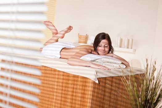 Spa - Young woman at wellness therapy treatment relaxing