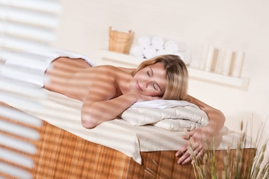 Spa - Young woman at wellness therapy treatment relaxing
