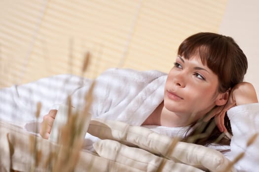 Spa - Young female client at wellness therapy massage treatment