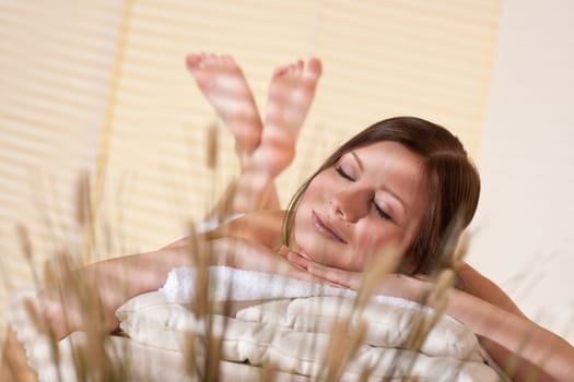 Spa - Young woman at wellness therapy treatment relaxing