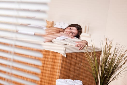 Spa - Young woman at wellness therapy treatment relaxing