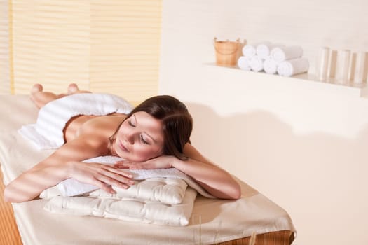 Spa - Young woman at wellness therapy treatment relaxing