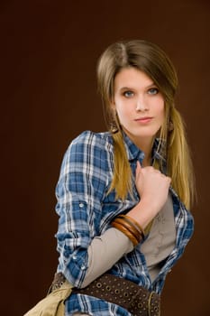 Fashion model - young woman posing in country style clothes