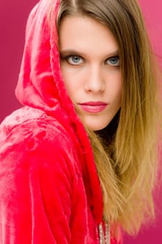 Fashion model - young trendy woman in pink, studio shoot