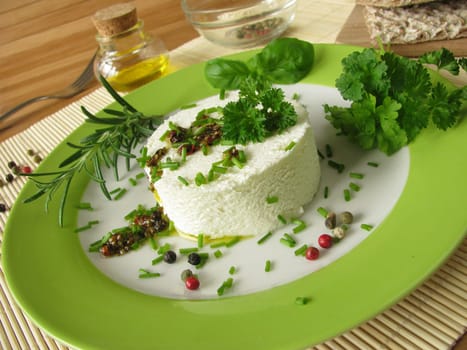 Goat's cream cheese with herb marinade and pepper